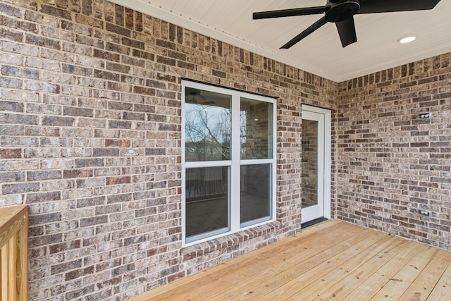 wooden terrace featuring ceiling fan