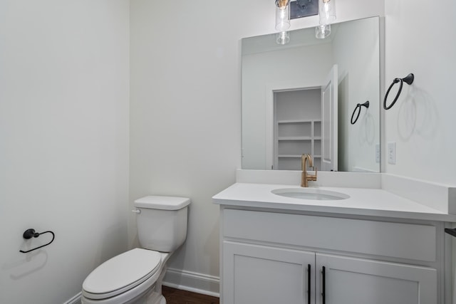 bathroom featuring vanity and toilet