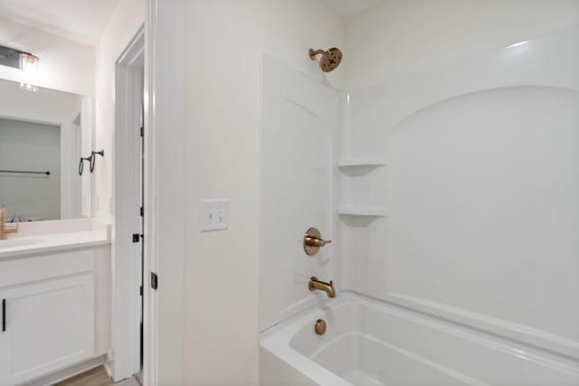 bathroom with vanity and tub / shower combination