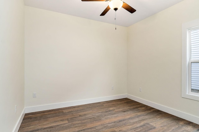 spare room featuring ceiling fan and dark hardwood / wood-style flooring