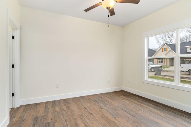 unfurnished room with hardwood / wood-style flooring and ceiling fan