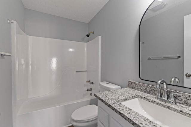 full bathroom featuring vanity, toilet, shower / tub combination, and a textured ceiling