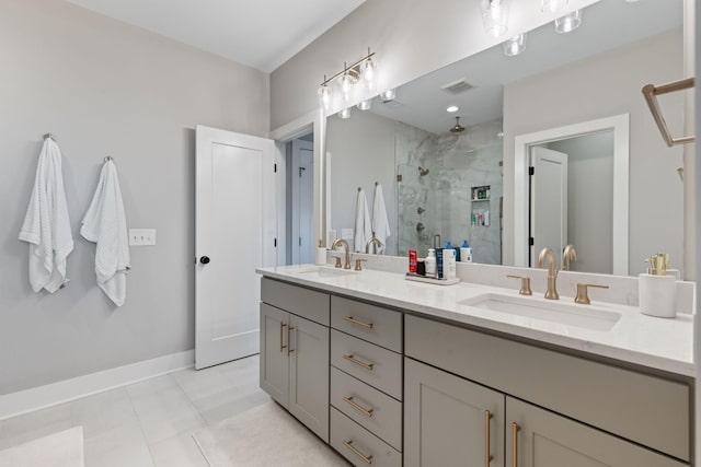 bathroom with tile patterned flooring, vanity, and a shower with door