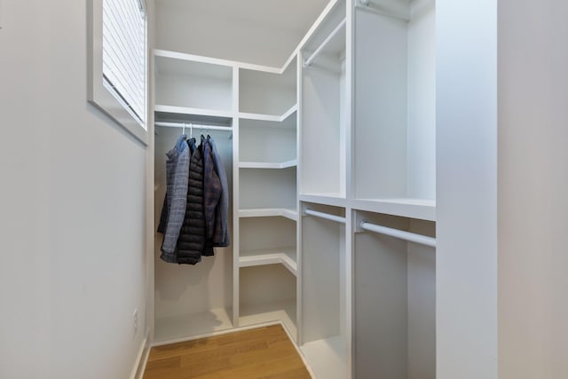 walk in closet featuring hardwood / wood-style floors