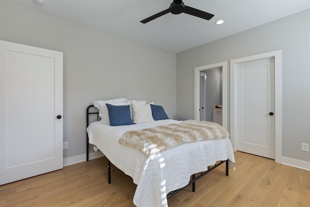 bedroom with ceiling fan and light hardwood / wood-style floors