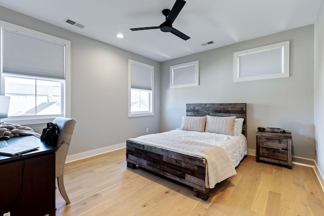 bedroom featuring light hardwood / wood-style flooring and ceiling fan