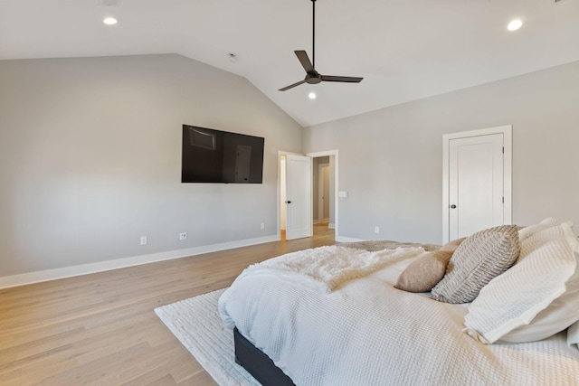 bedroom with light hardwood / wood-style flooring, ceiling fan, and lofted ceiling