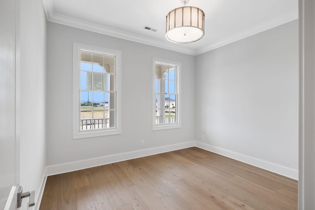 7085 Bolton St, Franklin, TN 37064 - spare room featuring light wood-style floors and ornamental molding