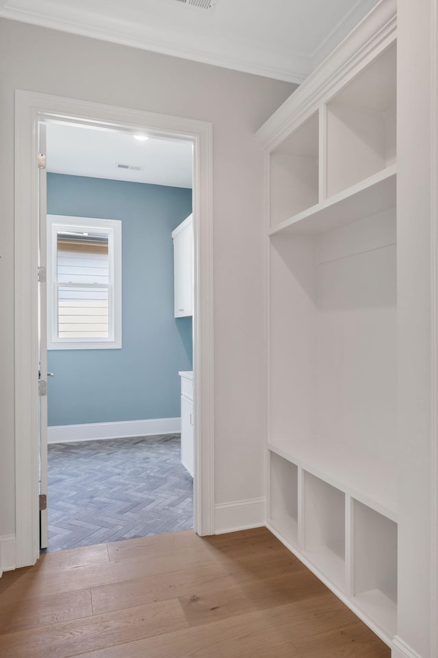 7085 Bolton St, Franklin, TN 37064 - mudroom featuring wood finished floors and ornamental molding