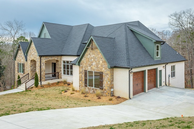 view of front facade with a garage and a front lawn