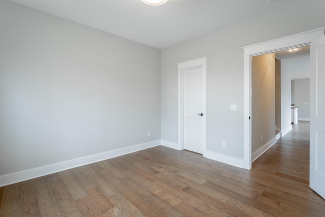 unfurnished bedroom featuring hardwood / wood-style flooring