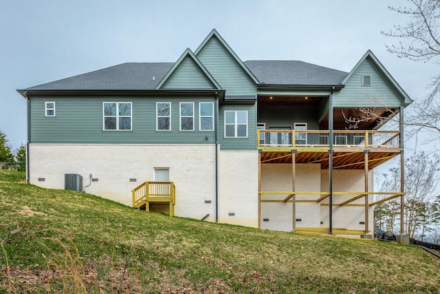 back of property featuring a yard and central AC