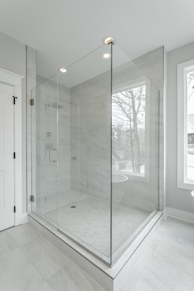 bathroom featuring an enclosed shower