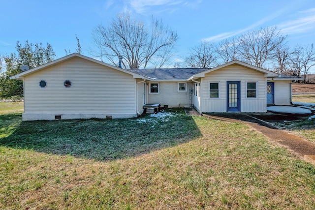 back of house featuring a lawn