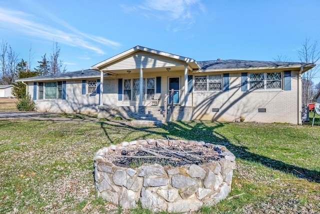 ranch-style house featuring a porch and a front lawn