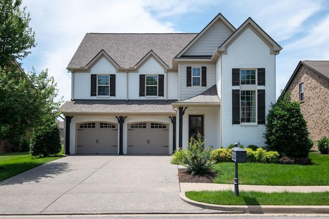 view of front facade featuring a front yard and a garage