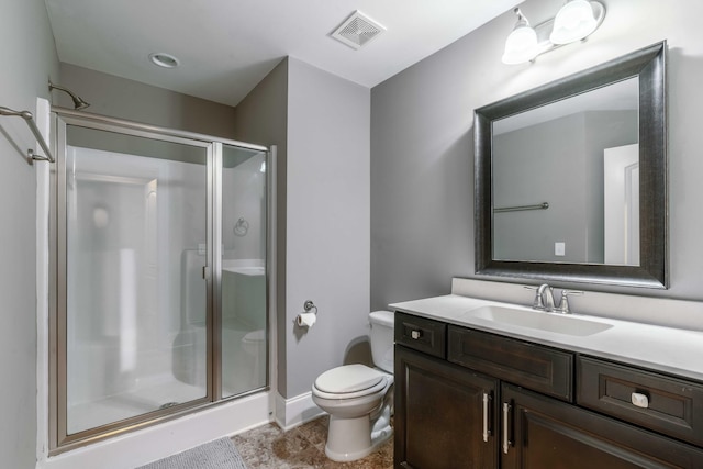 bathroom with vanity, an enclosed shower, and toilet