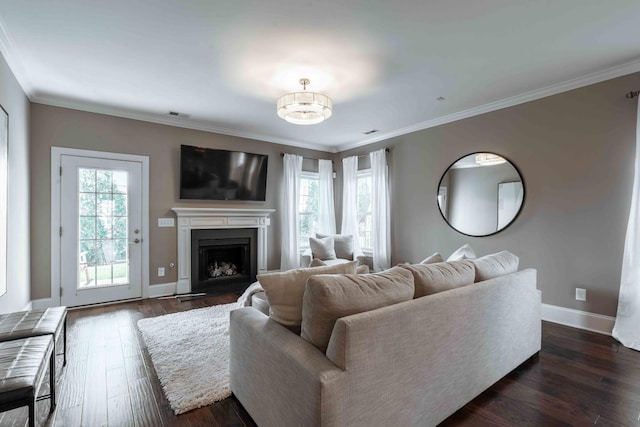 living room featuring a wealth of natural light and crown molding