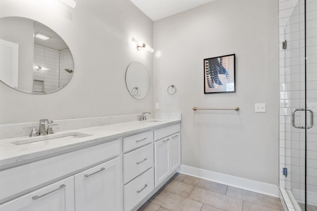 bathroom with vanity, tile patterned floors, and a shower with door