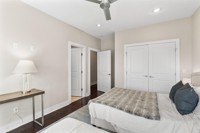 bedroom with ceiling fan, dark hardwood / wood-style flooring, and a closet