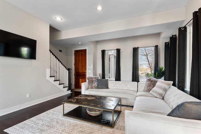 living room featuring dark wood-type flooring