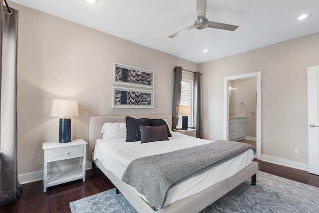 bedroom featuring ensuite bath, ceiling fan, and dark hardwood / wood-style flooring