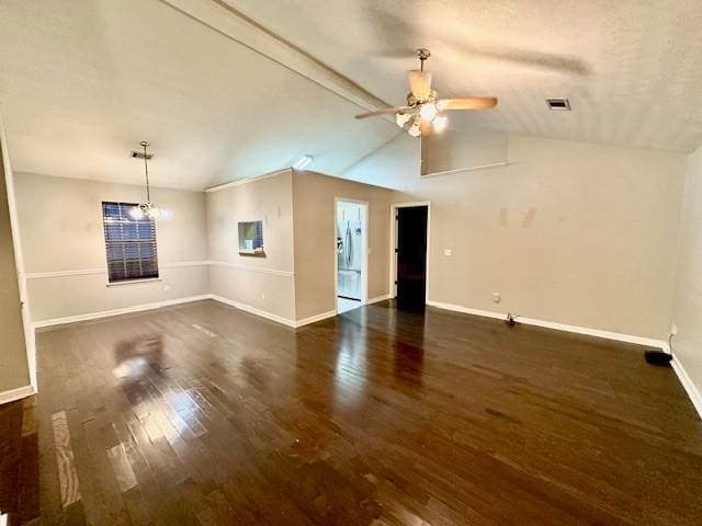 unfurnished living room with ceiling fan with notable chandelier, dark hardwood / wood-style flooring, and vaulted ceiling