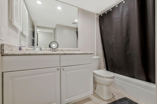 full bathroom featuring tile patterned floors, vanity, shower / bath combination with curtain, and toilet