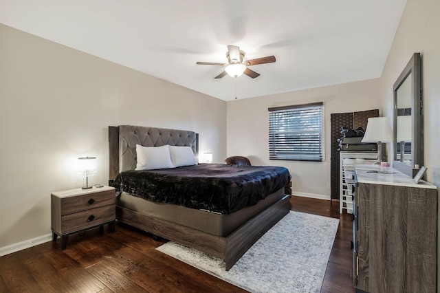 bedroom with dark hardwood / wood-style floors and ceiling fan