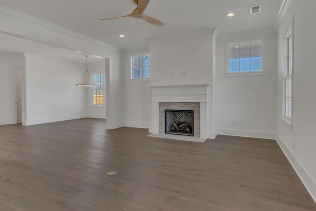 unfurnished living room featuring dark wood-style floors, a fireplace, visible vents, ornamental molding, and baseboards