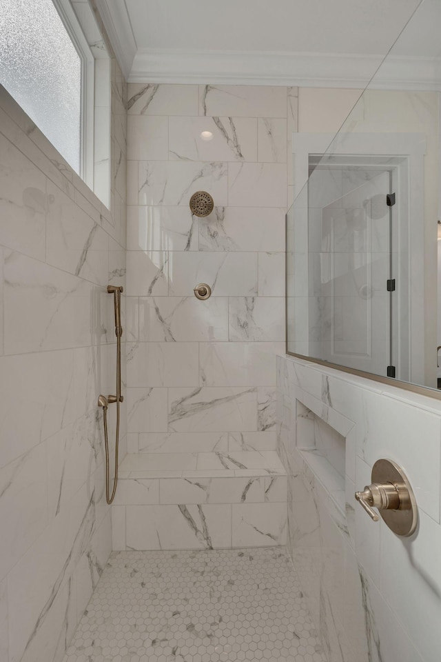 full bath featuring ornamental molding and tiled shower