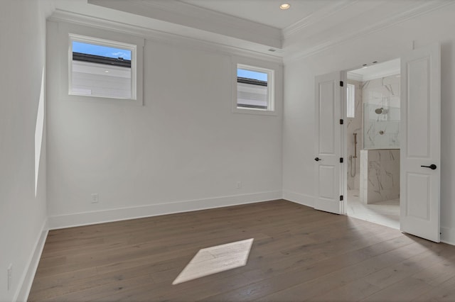 spare room with hardwood / wood-style flooring, baseboards, crown molding, and recessed lighting