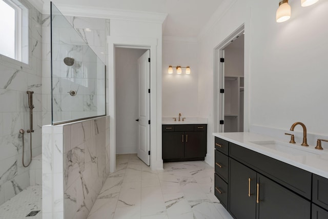 full bath featuring ornamental molding, marble finish floor, a sink, and a marble finish shower