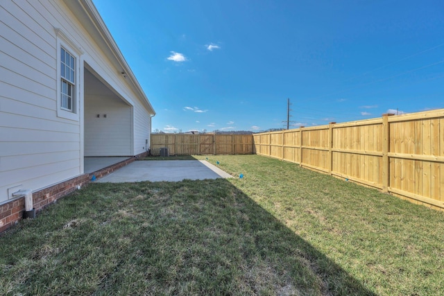 view of yard with a fenced backyard and a patio