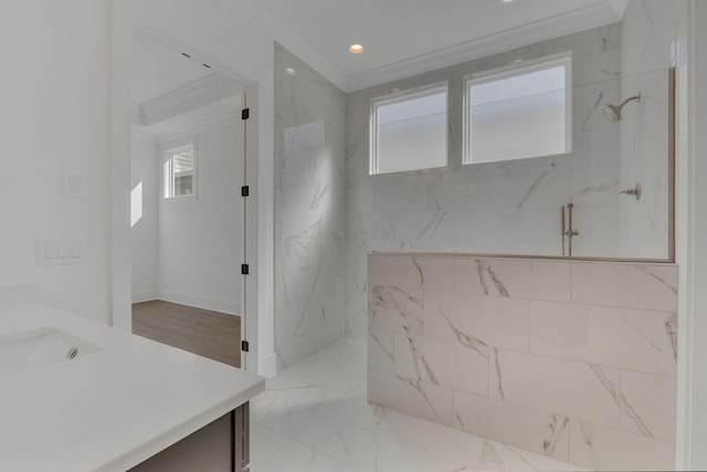 full bath featuring a marble finish shower, marble finish floor, crown molding, vanity, and recessed lighting