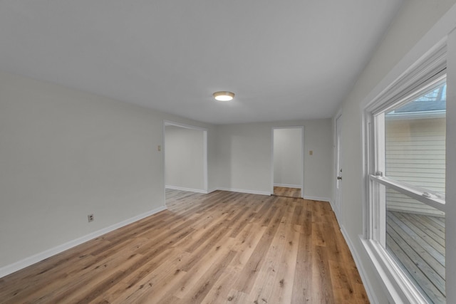 spare room featuring light wood-type flooring