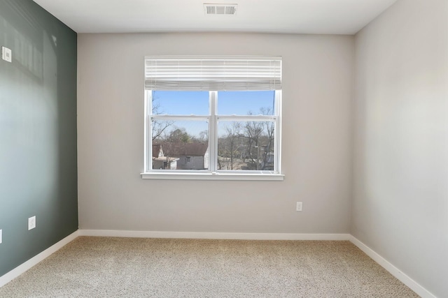 unfurnished room with carpet flooring