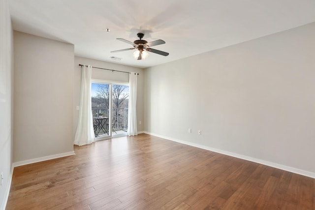 spare room featuring ceiling fan and wood-type flooring