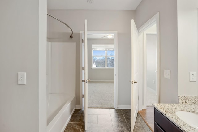 bathroom with shower / bathing tub combination, vanity, and tile patterned floors