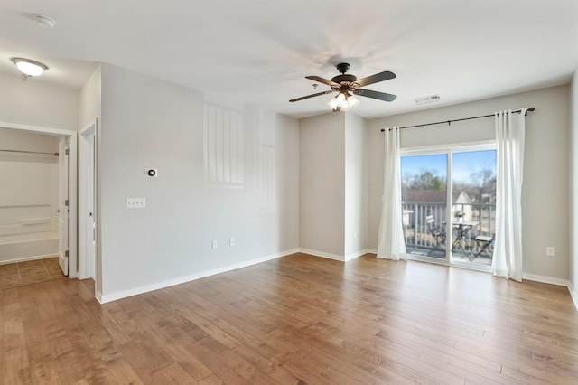 unfurnished room featuring light hardwood / wood-style floors and ceiling fan