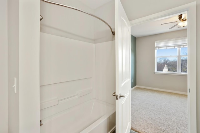 bathroom featuring shower / bath combination and ceiling fan