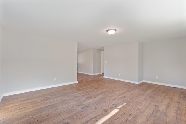 spare room featuring hardwood / wood-style floors