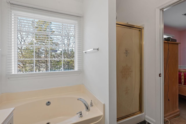 bathroom with separate shower and tub and vanity