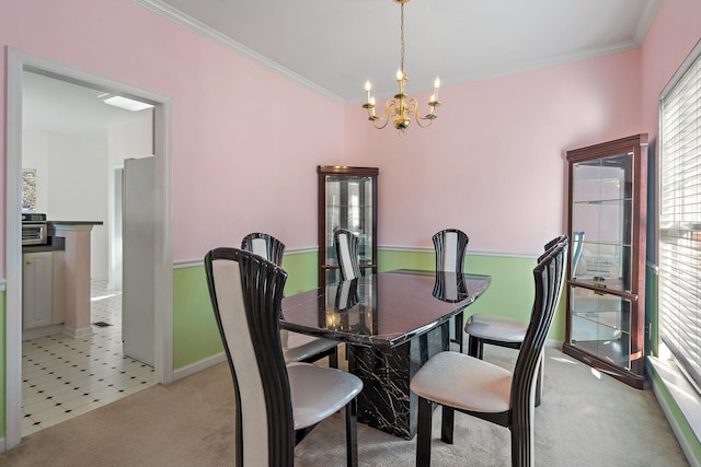 dining room with a notable chandelier, light colored carpet, and ornamental molding