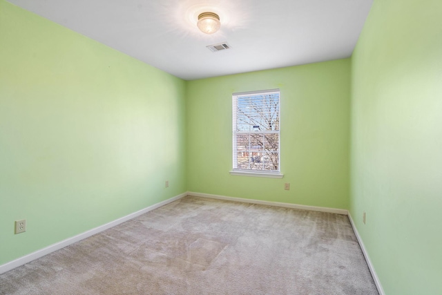 unfurnished room with light colored carpet