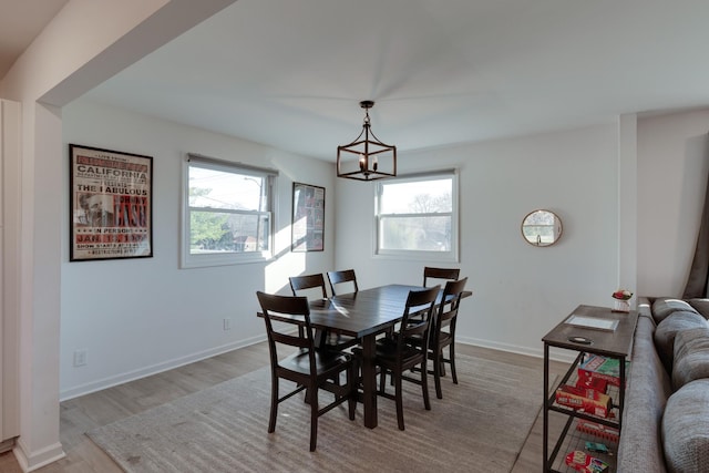 dining area with a healthy amount of sunlight and light wood-type flooring