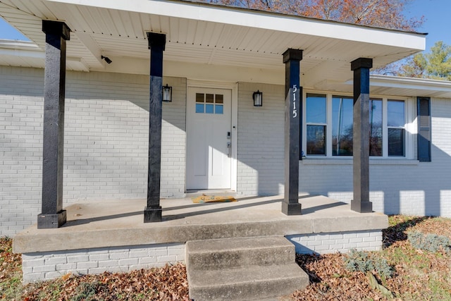 view of exterior entry with covered porch