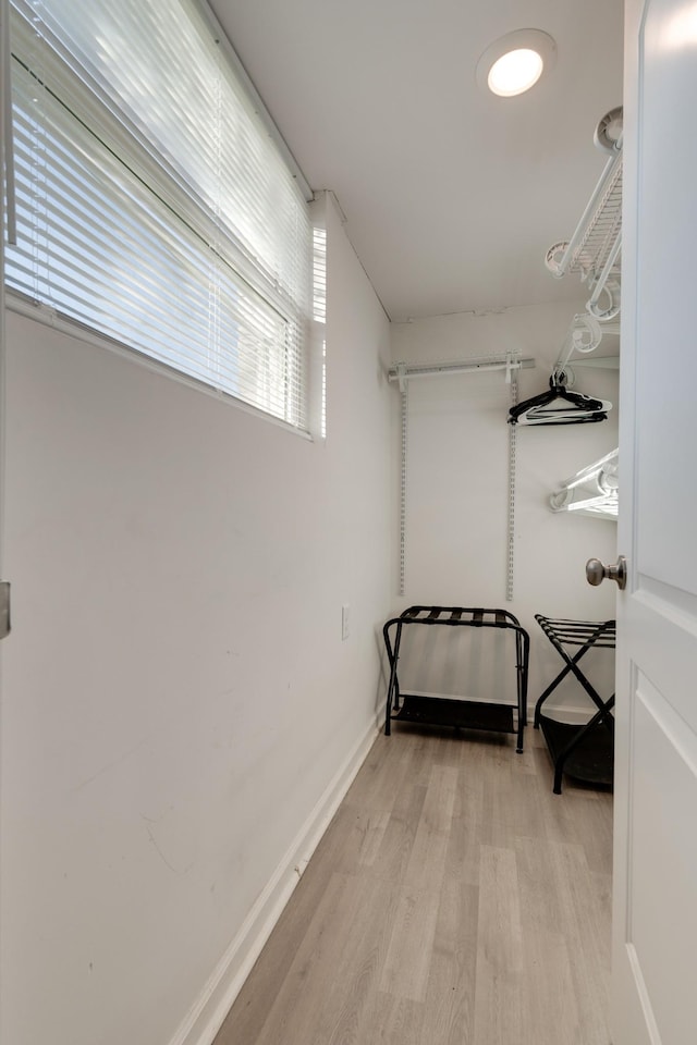 spacious closet featuring light wood-type flooring