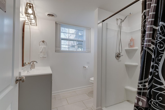 bathroom featuring tile patterned floors, vanity, toilet, and a shower with curtain