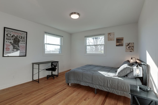 bedroom with light hardwood / wood-style flooring